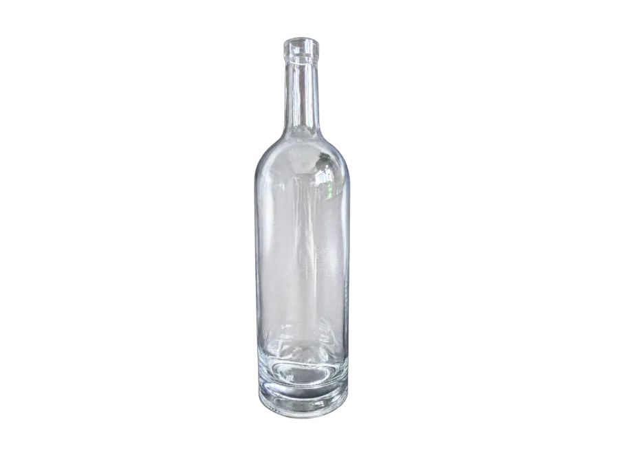 Clear glass bottle with a long narrow neck and thick base against a dark background
