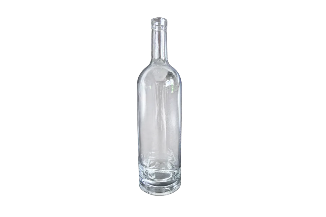 Clear glass bottle with a long narrow neck and thick base against a dark background