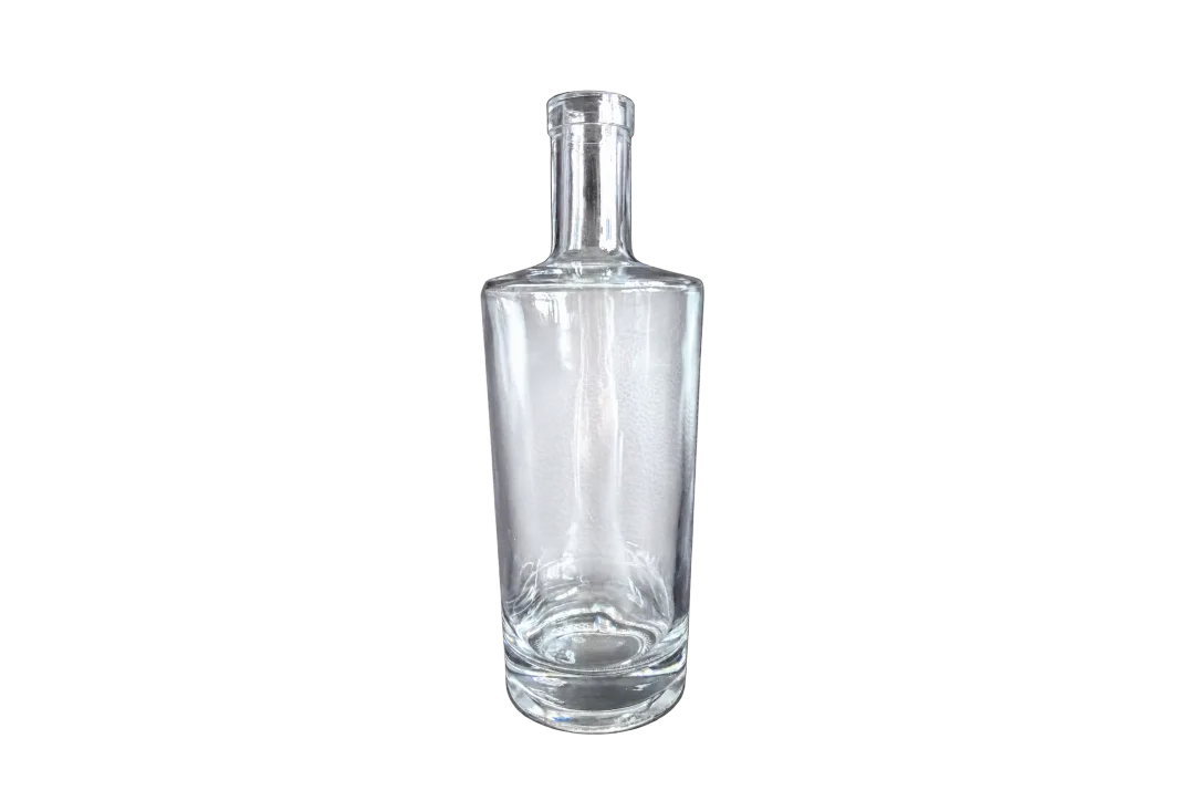 Clear empty cylindrical glass bottle with a long neck and transparent closure on a dark background