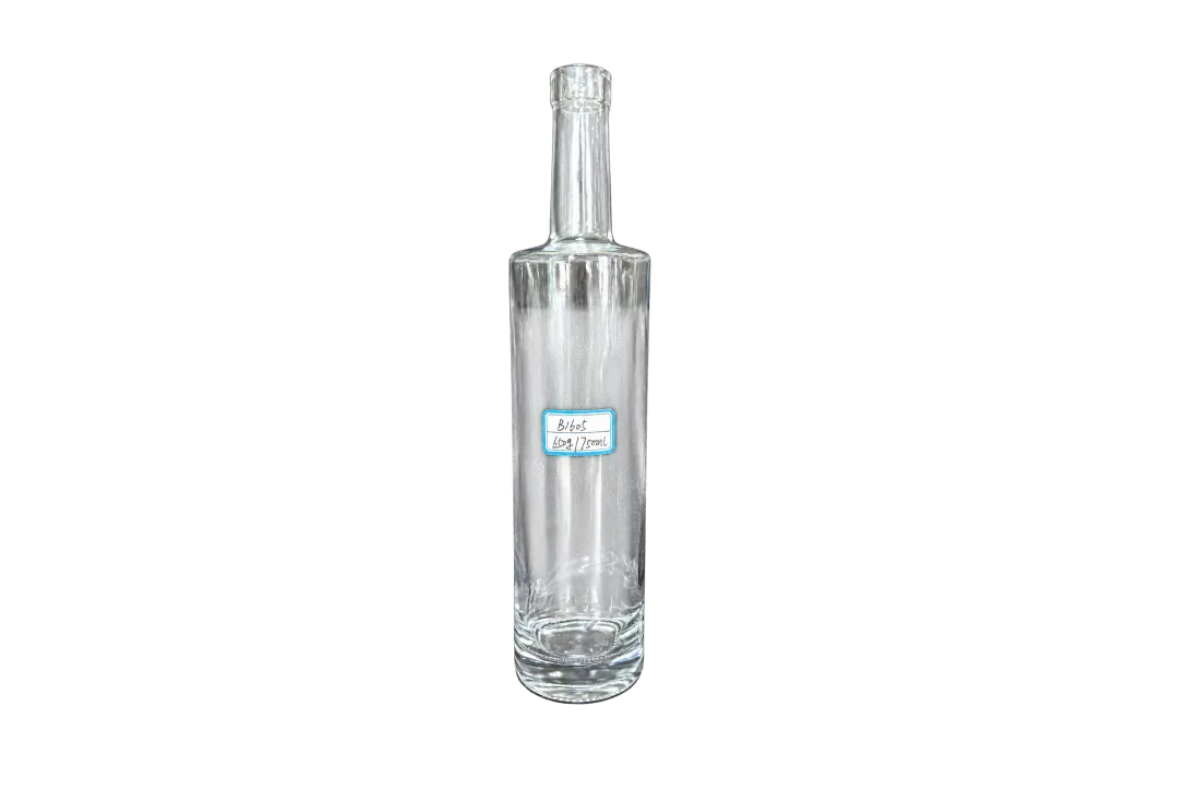 Empty clear 750ml glass bottle with a handwritten 650g label against a gray textured background