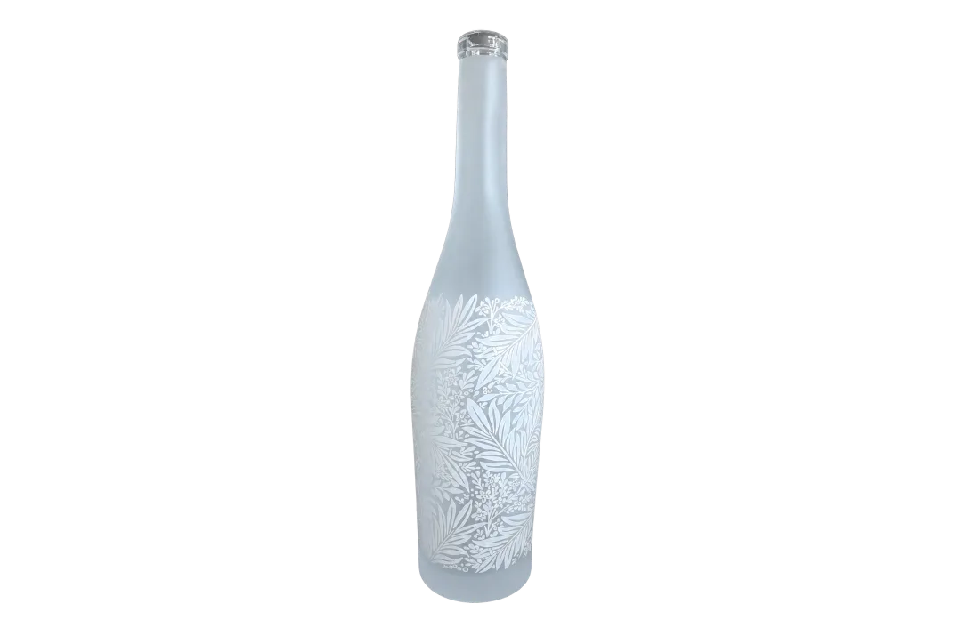 Tall frosted bottle with a clear closure and white botanical foliage pattern
