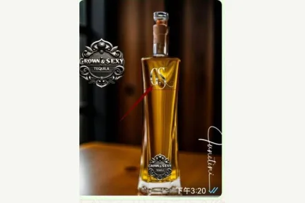 Tall amber tequila bottle with ornate black-and-silver Grown & Sexy branding and GS emblem.
