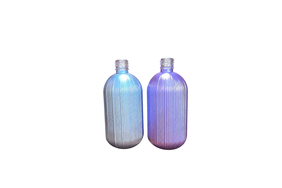 Blue and purple vertically ribbed bottles with transparent threaded necks on a wooden surface